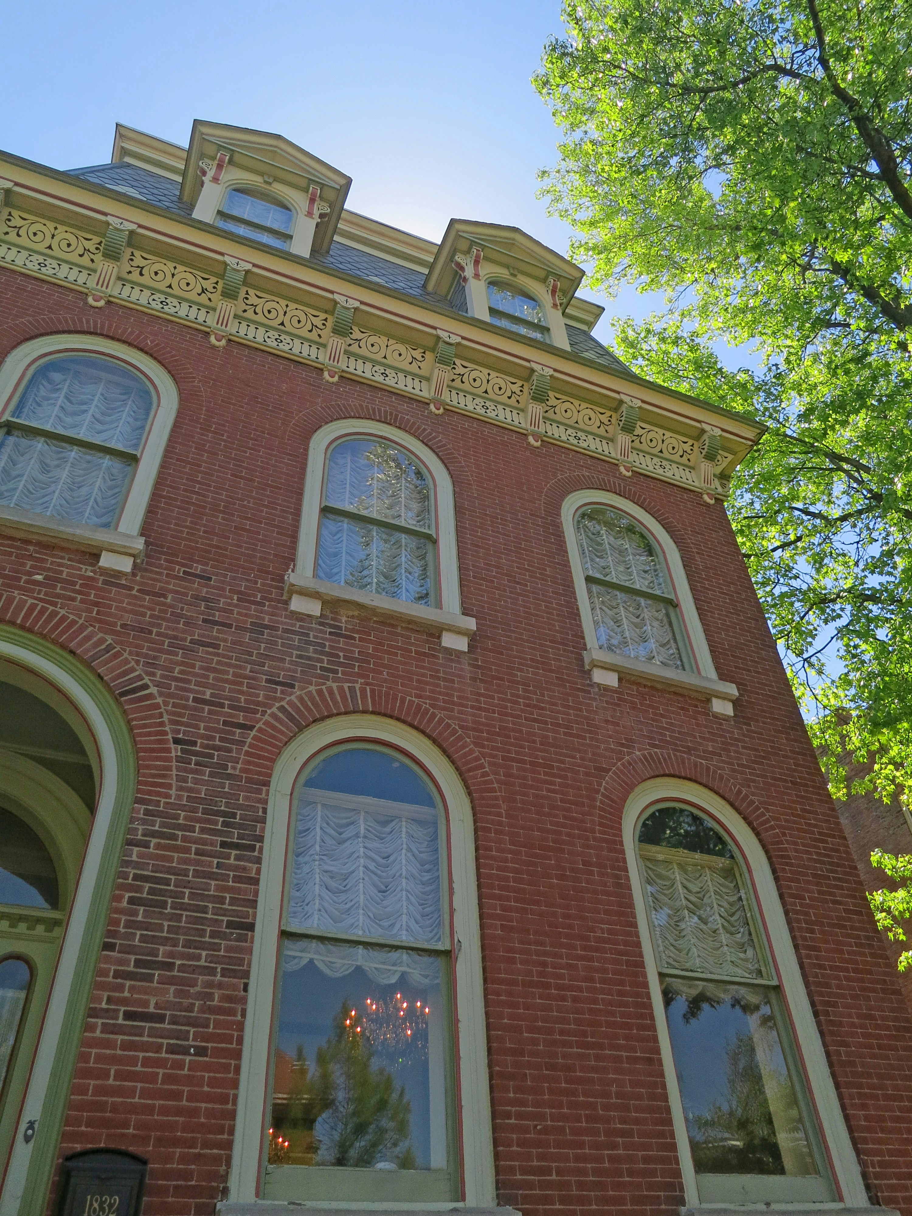 Ornate brick home exterior with arched windows