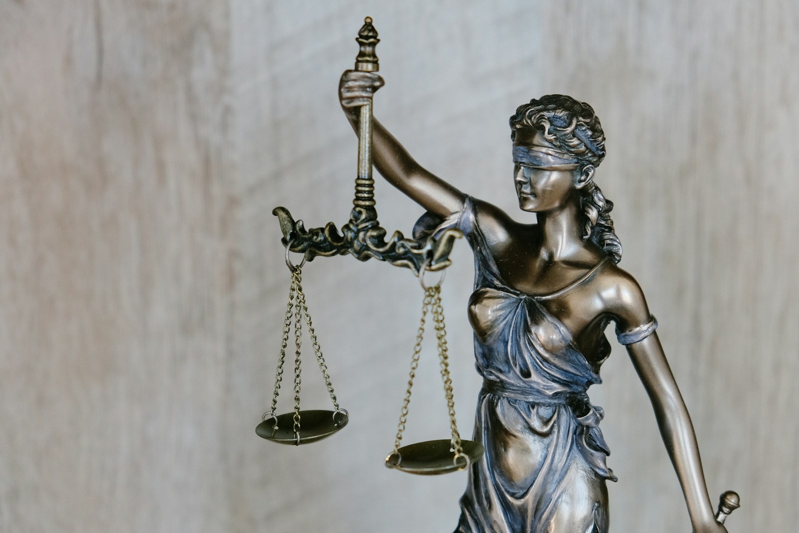 A statue of Lady Justice holding a set of scales